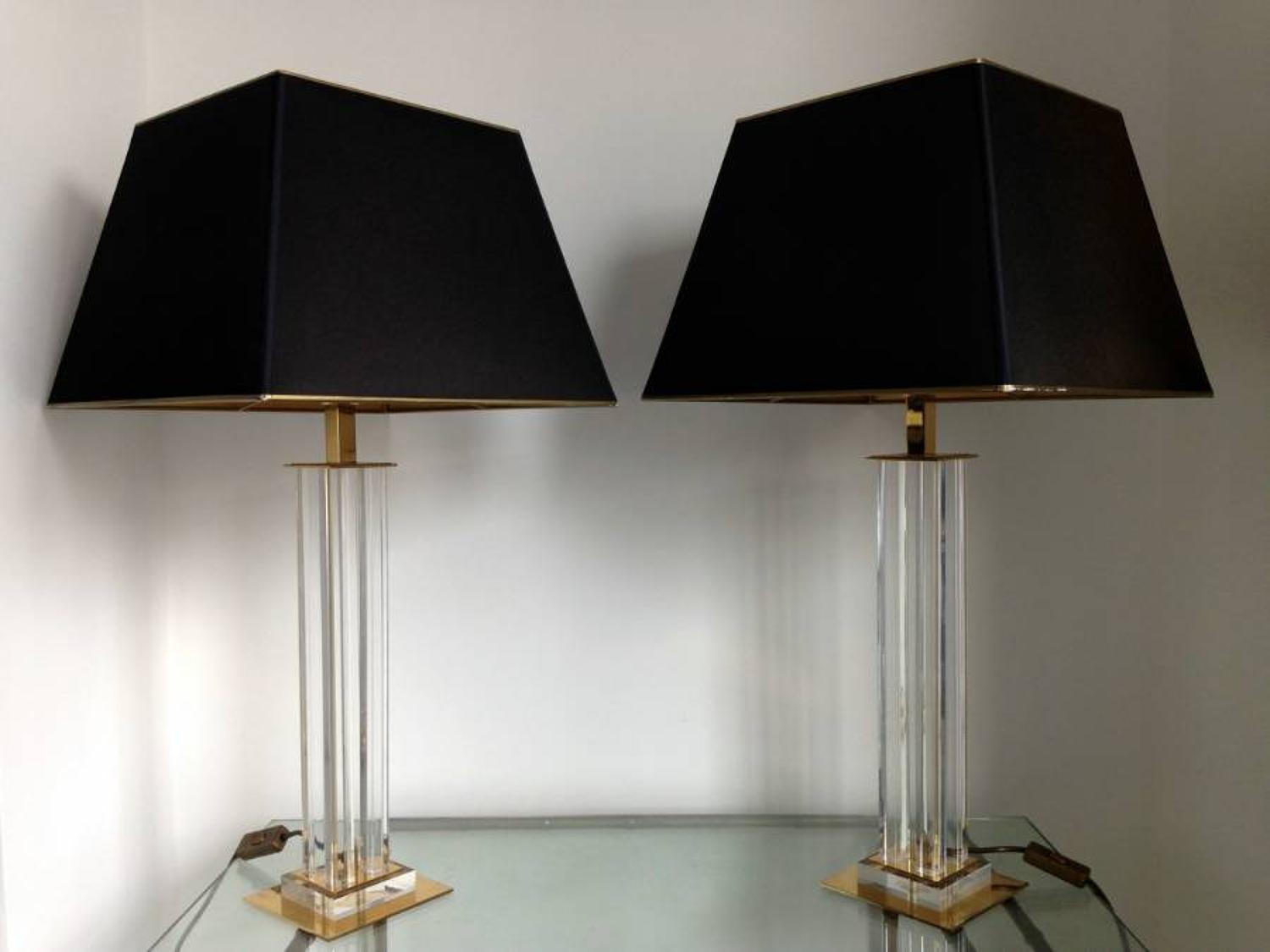 A pair of lucite and brass table lamps