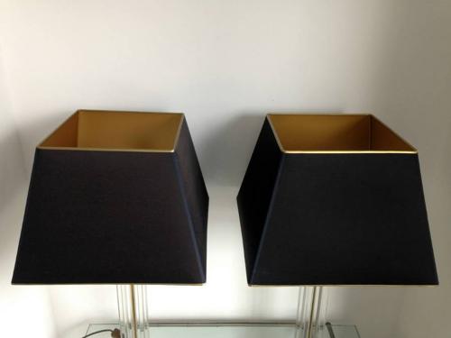 A pair of lucite and brass table lamps