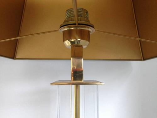 A pair of lucite and brass table lamps