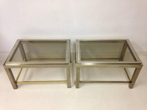 A pair of two tier chrome side tables