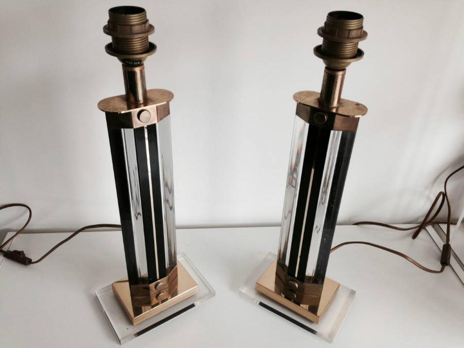 A pair of lucite and brass table lamps