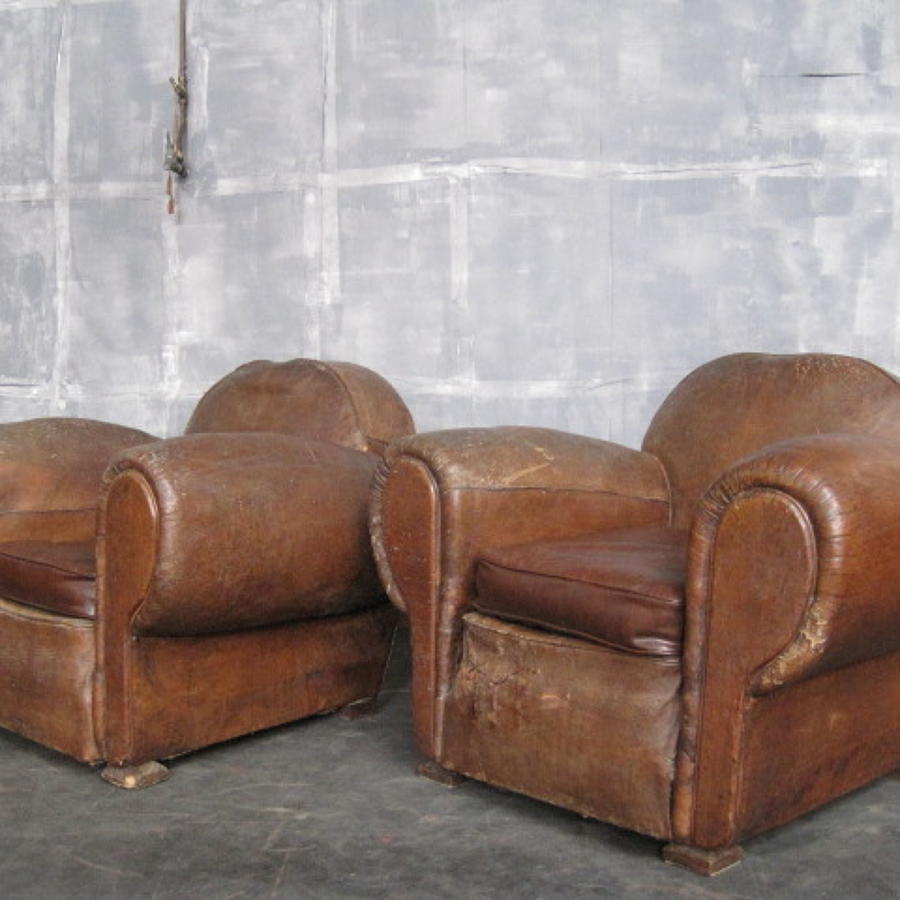 A pair of vintage leather armchairs