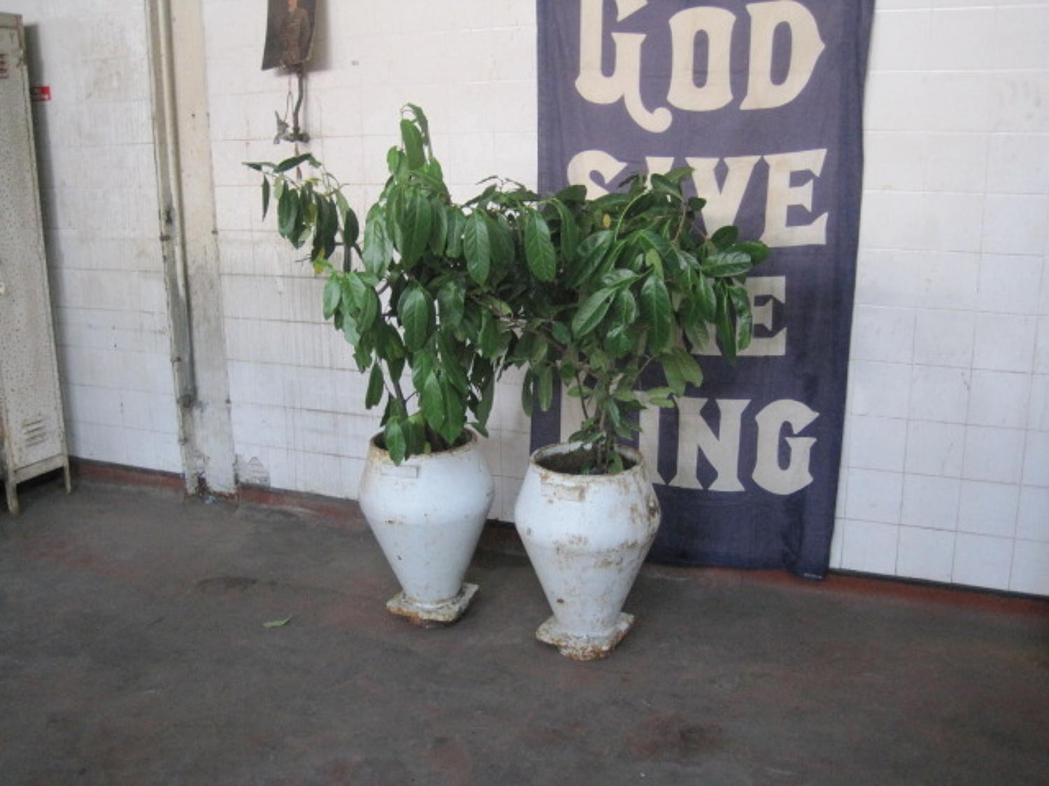 A pair of antique cast iron pots