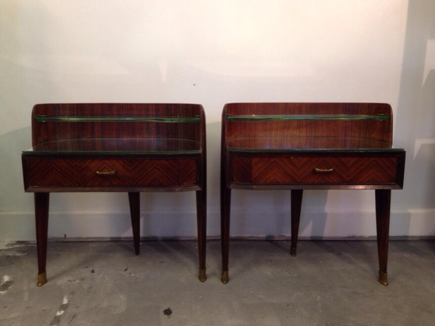 A pair of rosewood bedside tables