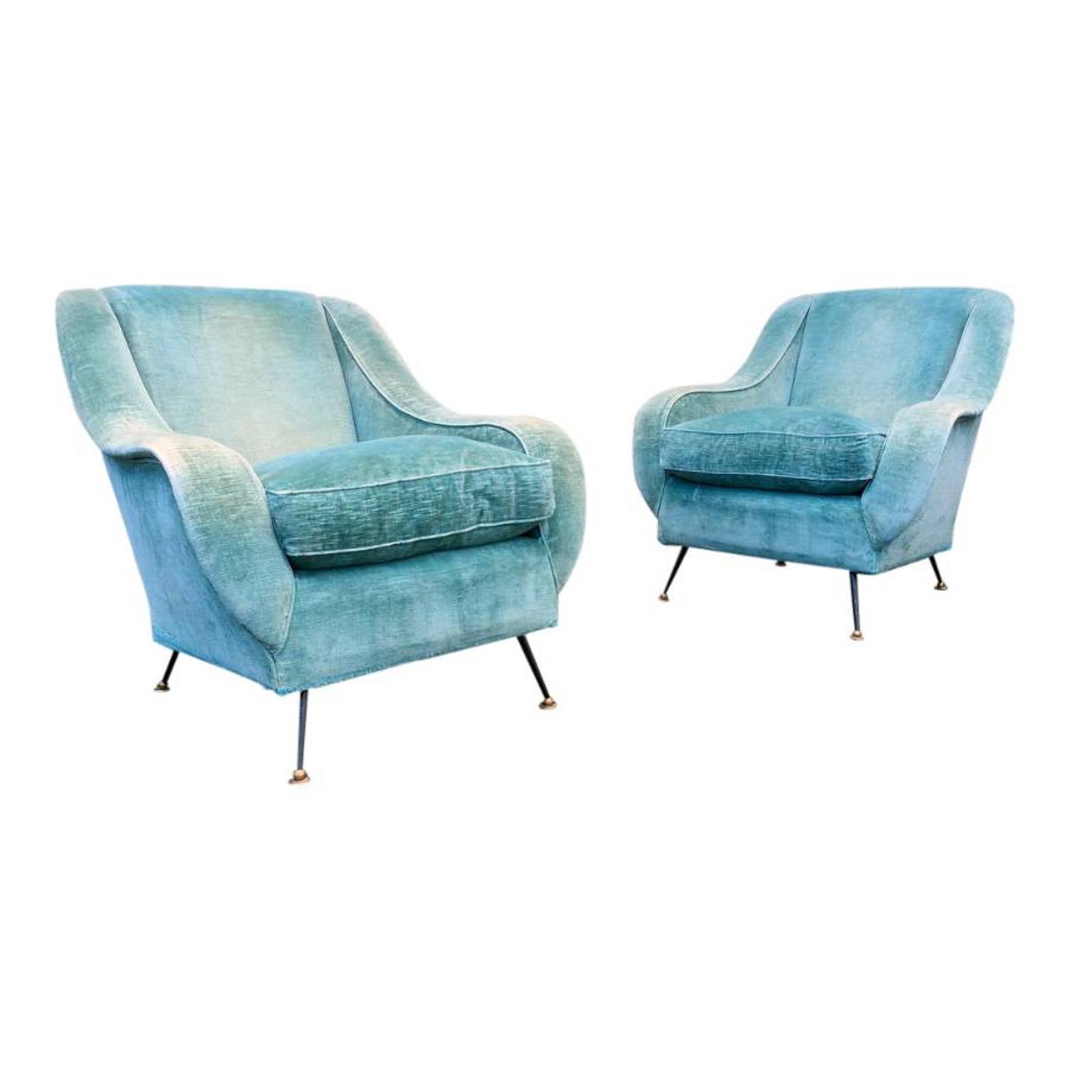 A pair of 1950s Italian armchairs with brass feet