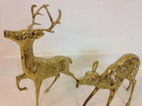 A pair of vintage brass reindeers