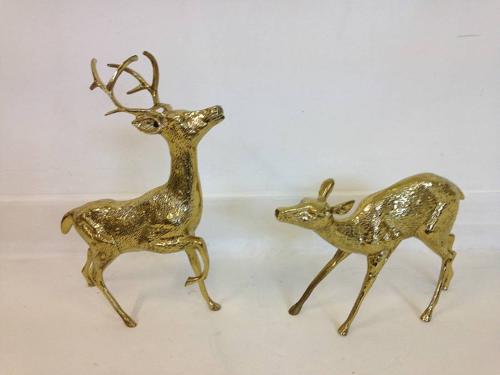A pair of vintage brass reindeers