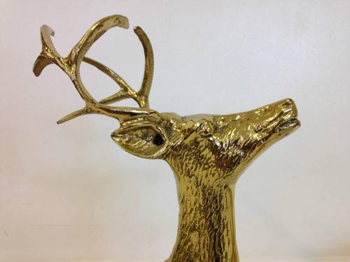 A pair of vintage brass reindeers
