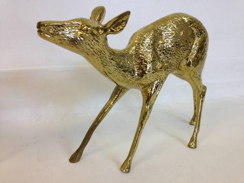 A pair of vintage brass reindeers