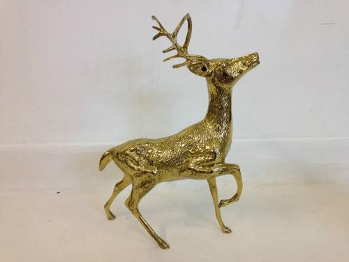 A pair of vintage brass reindeers