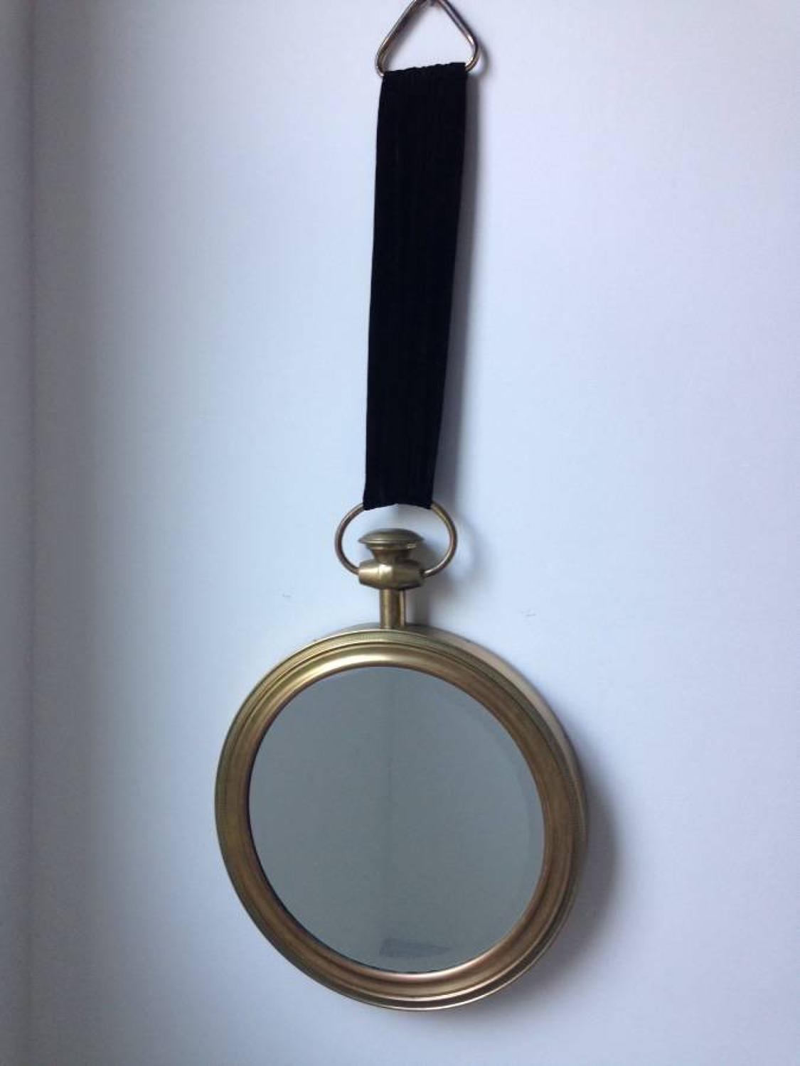 Brass pocket watch mirror by Fornasetti