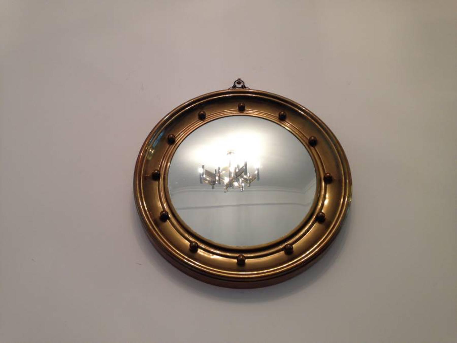 Brass framed regency style convex mirror