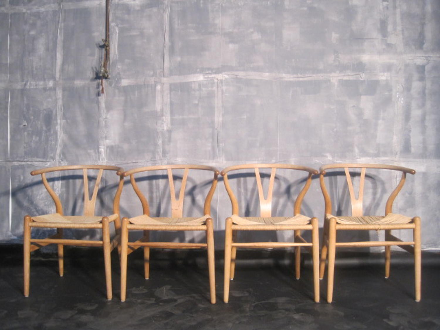 Four wishbone chairs by Hans Wegner in oak