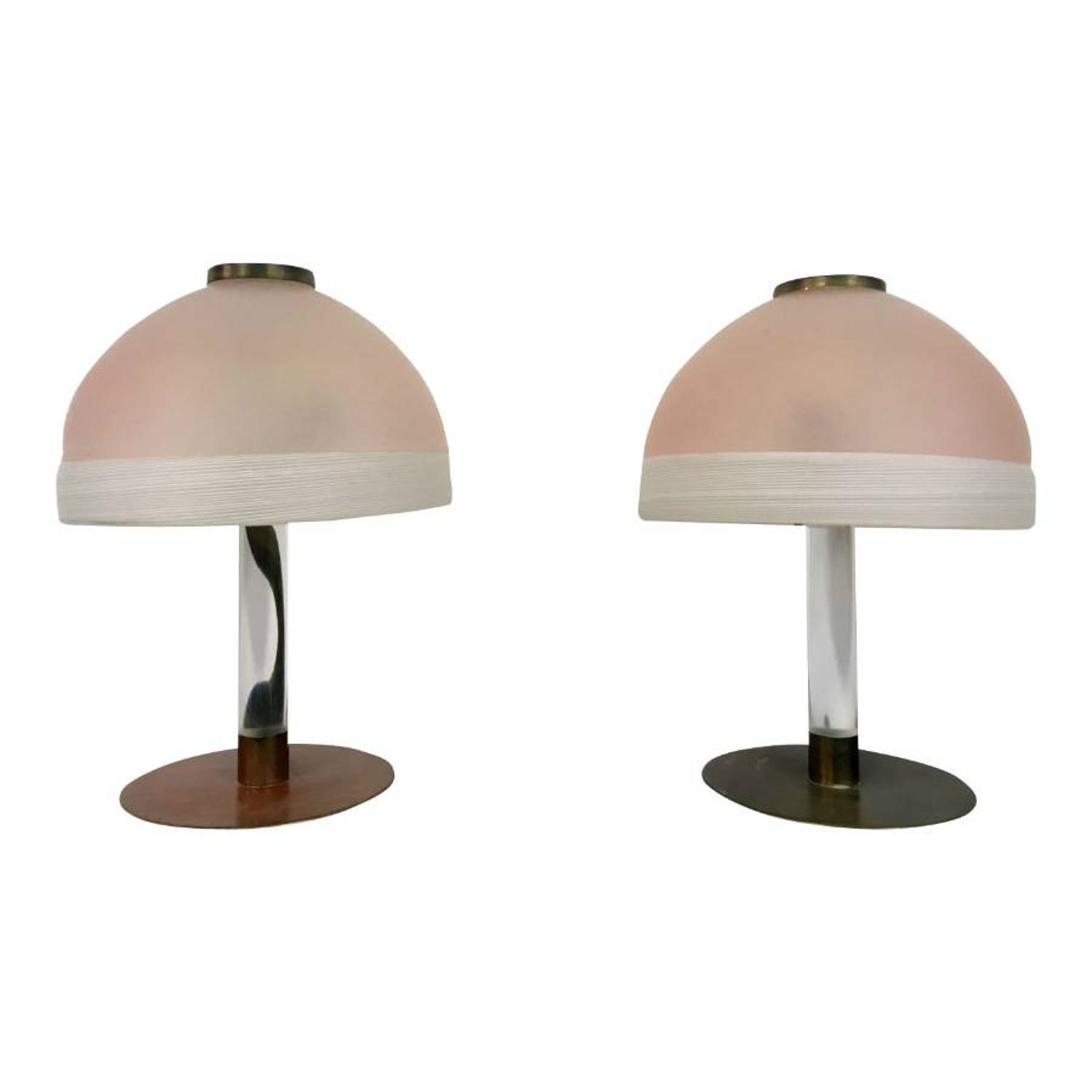 A pair of pink glass and lucite table lamps