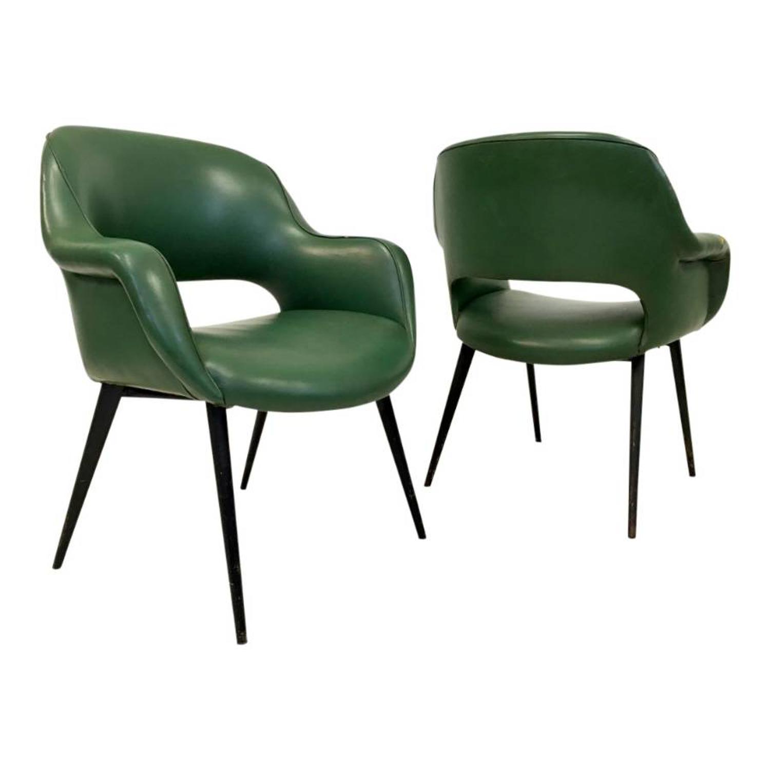 A pair of Italian armchairs with metal legs