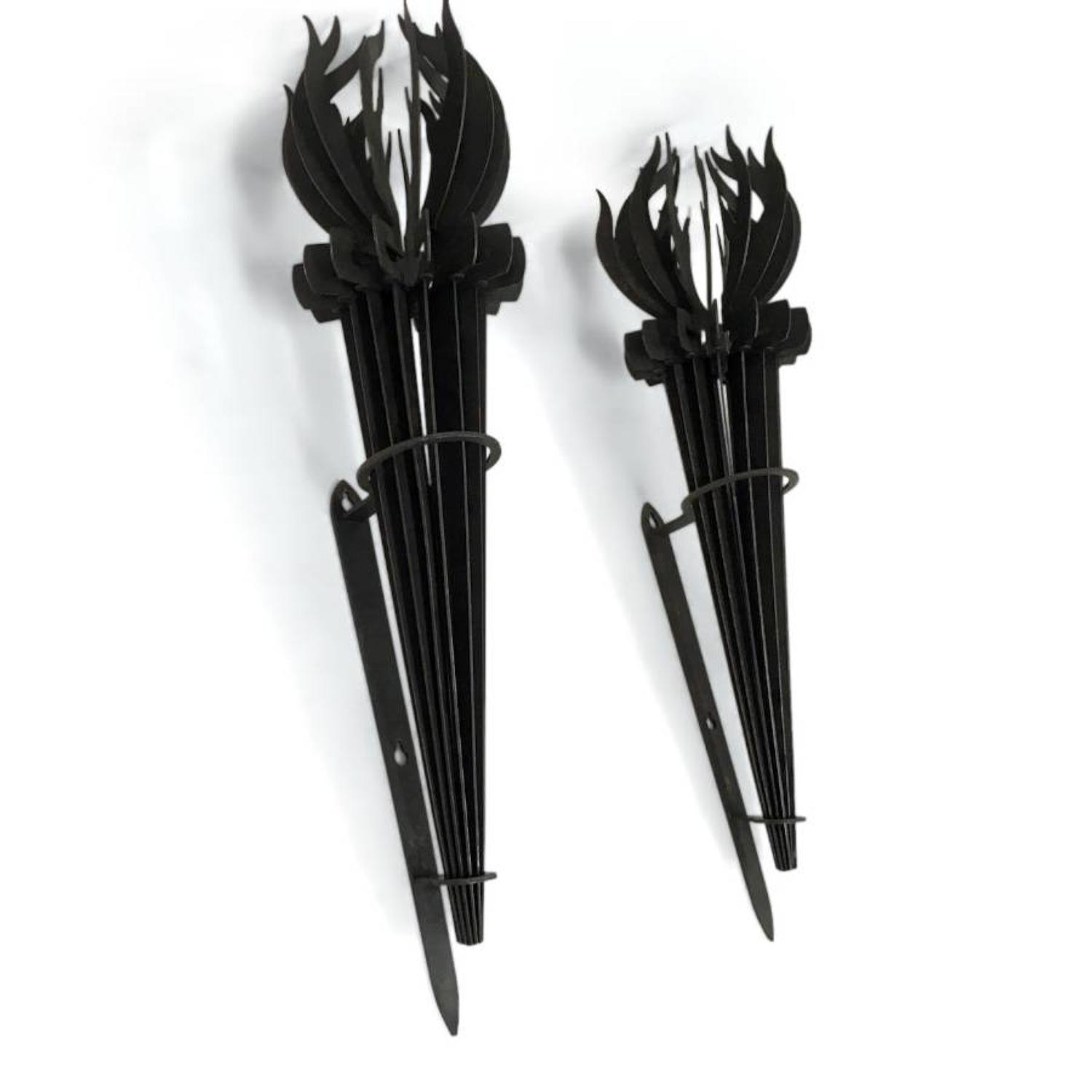 A pair of French iron torch wall sconces