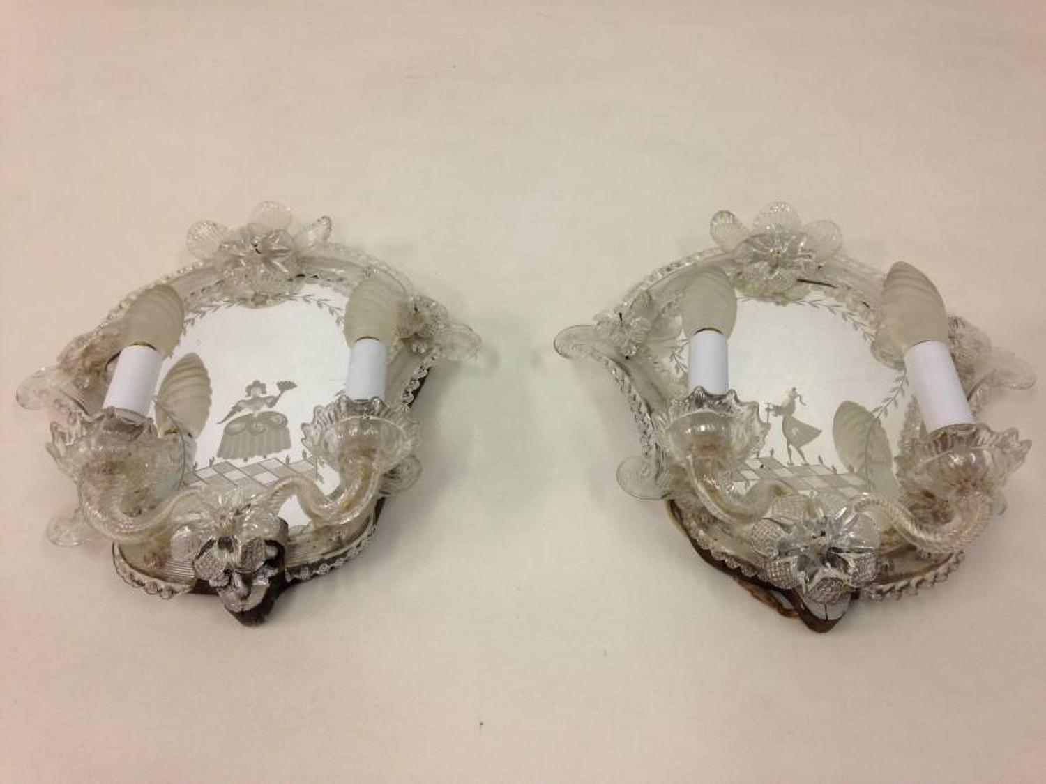 A pair of Venetian mirrored wall sconces