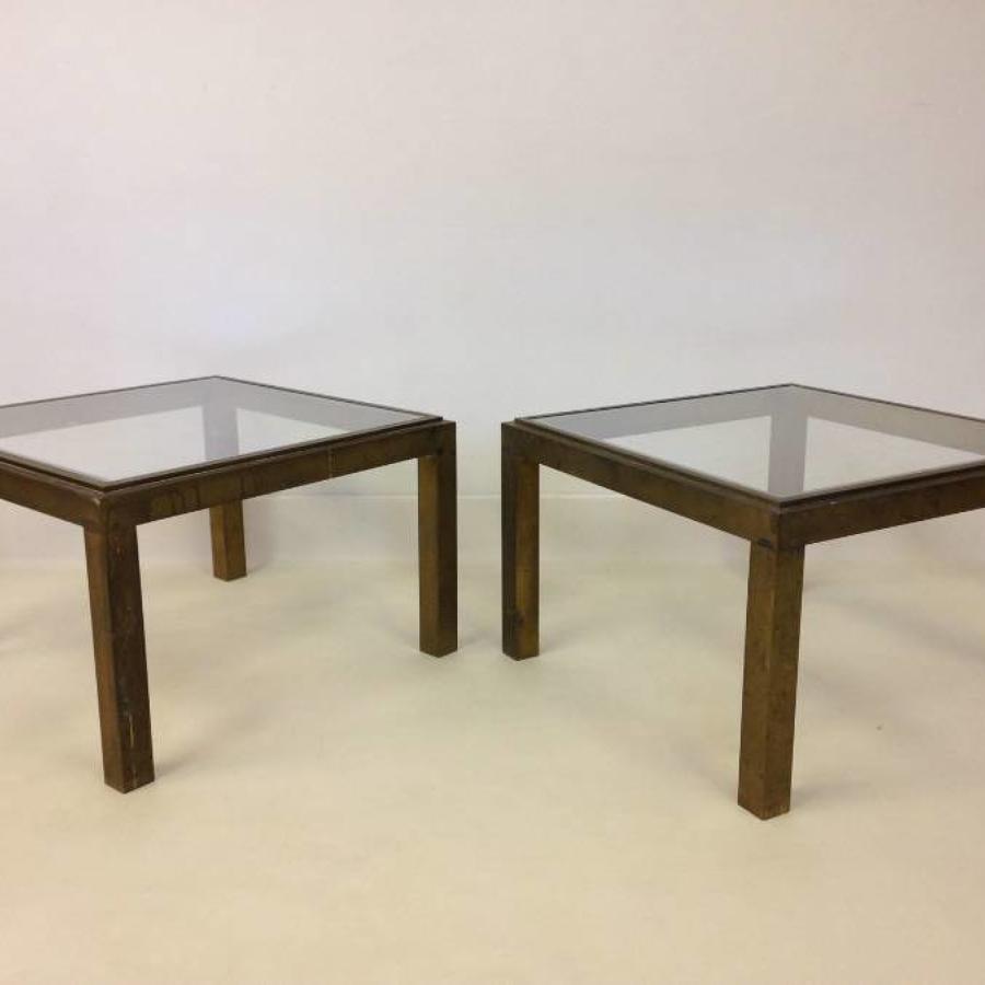 A pair of brass side tables
