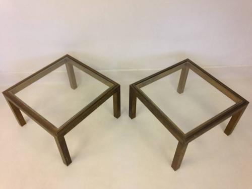 A pair of brass side tables