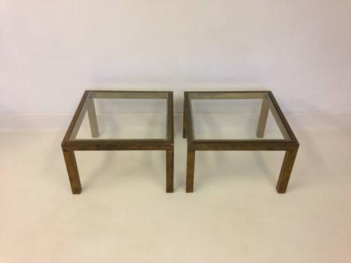 A pair of brass side tables