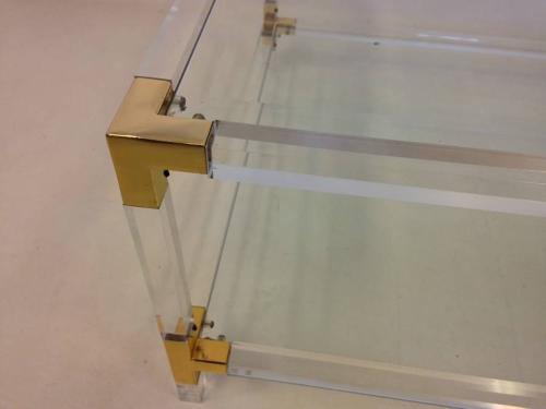 Lucite and brass coffee table