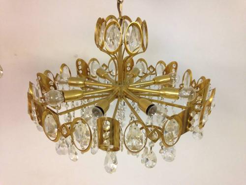 A pair of gilt brass and crystal chandeliers
