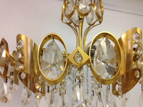 A pair of gilt brass and crystal chandeliers
