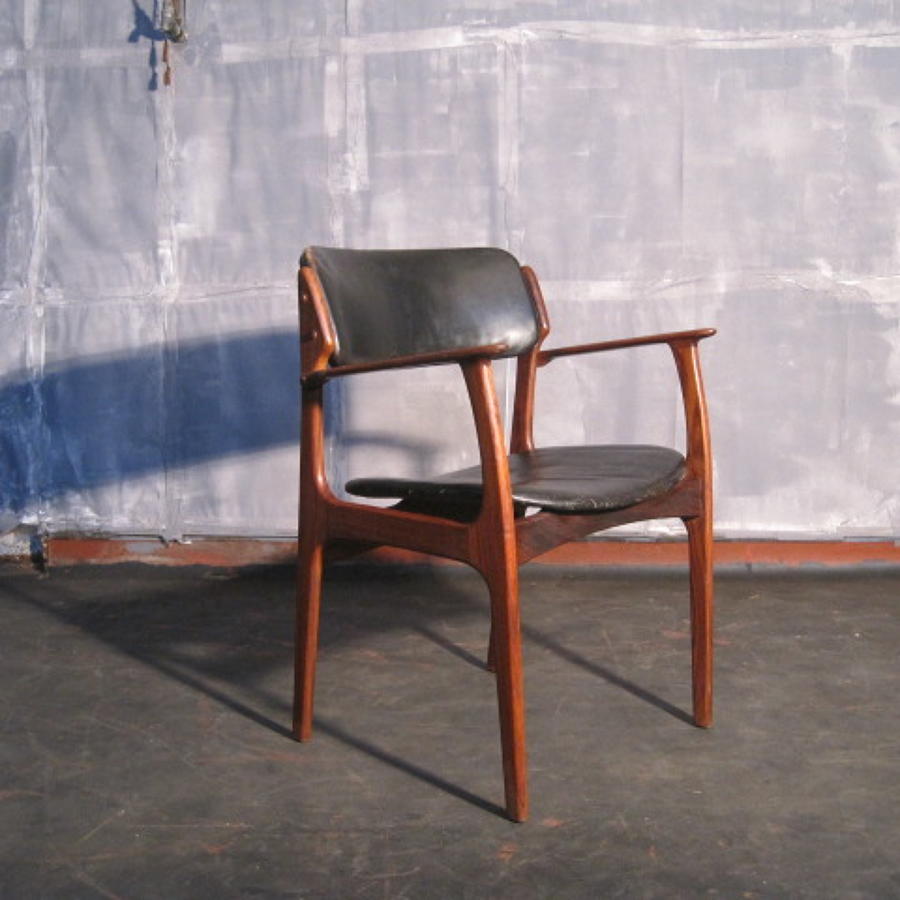 Rosewood and leather armchair by Erik Buck