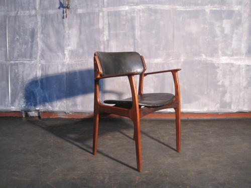 Rosewood and leather armchair by Erik Buck