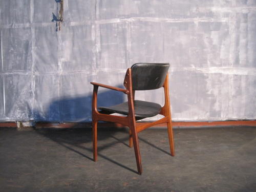 Rosewood and leather armchair by Erik Buck