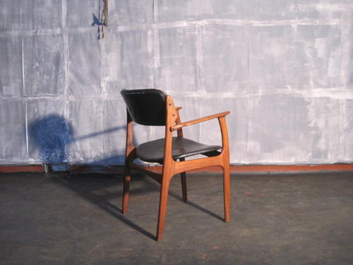 Rosewood and leather armchair by Erik Buck
