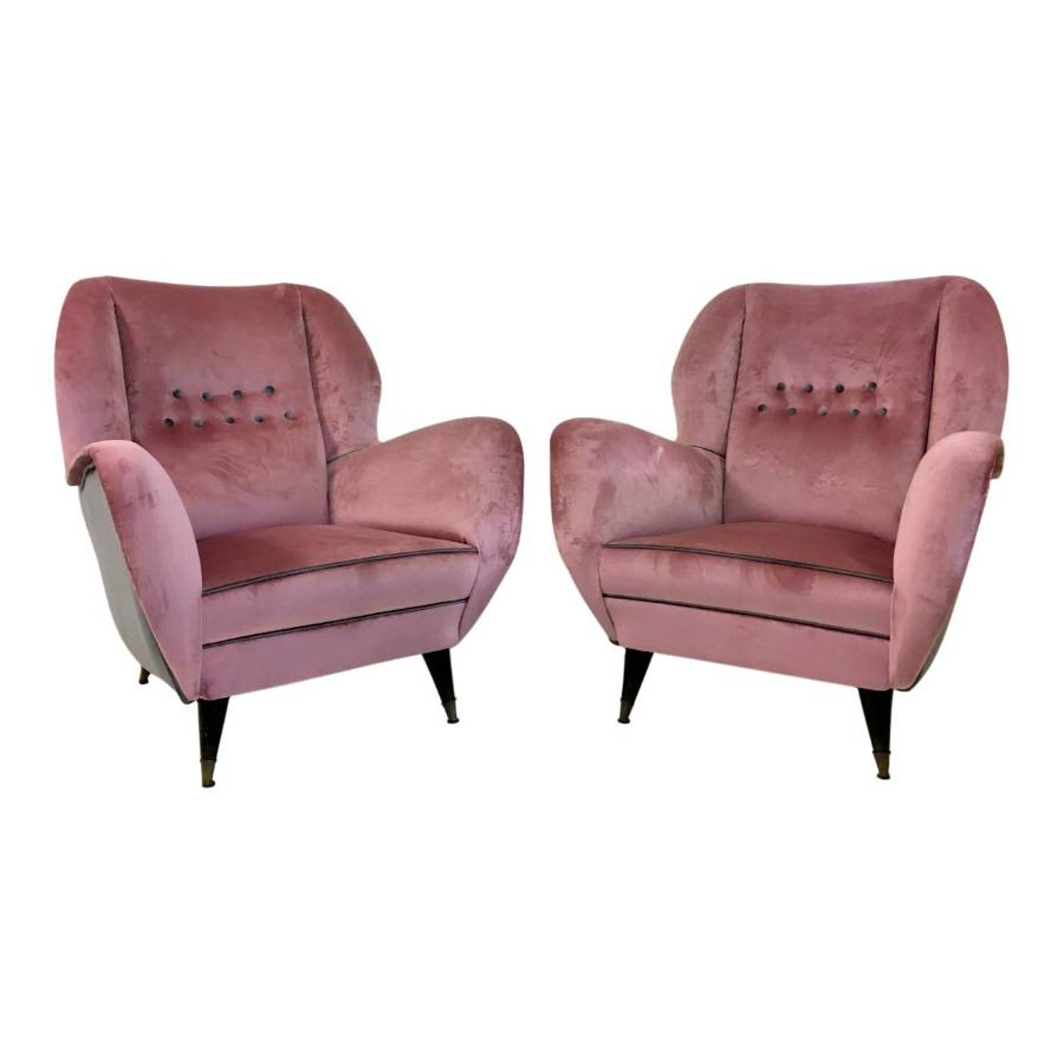 A pair of velvet upholstered Italian armchairs
