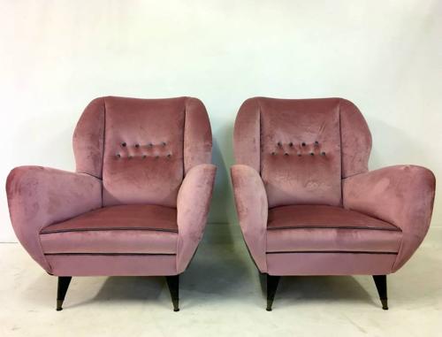 A pair of velvet upholstered Italian armchairs