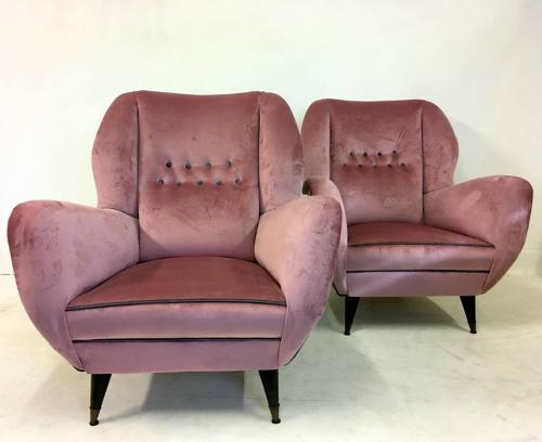 A pair of velvet upholstered Italian armchairs