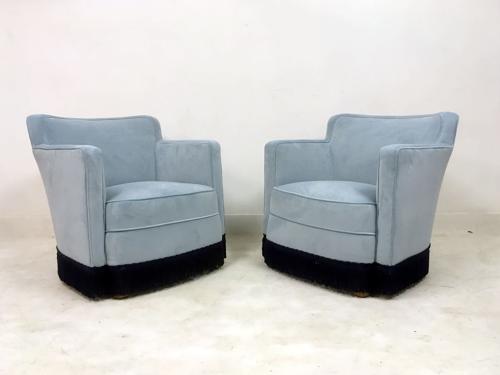 A pair of early 20th Century lounge chairs in blue velvet
