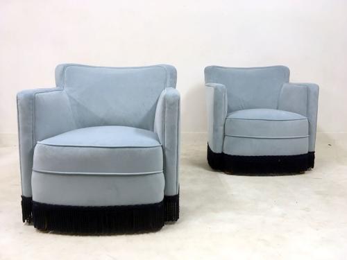 A pair of early 20th Century lounge chairs in blue velvet