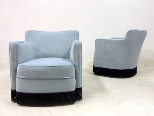 A pair of early 20th Century lounge chairs in blue velvet