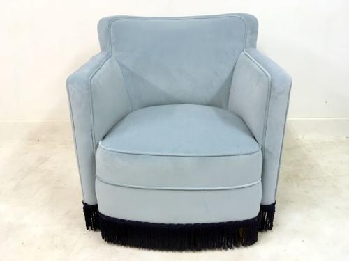 A pair of early 20th Century lounge chairs in blue velvet